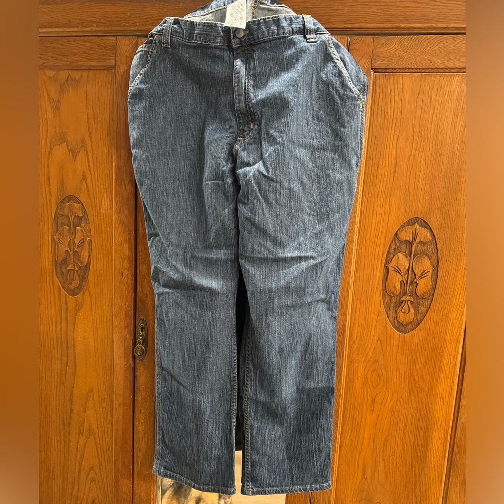 Carhartt cargo jeans. No rips, tears or holes zipper works great. 40x32